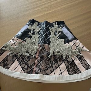 Short embellished designer skirt